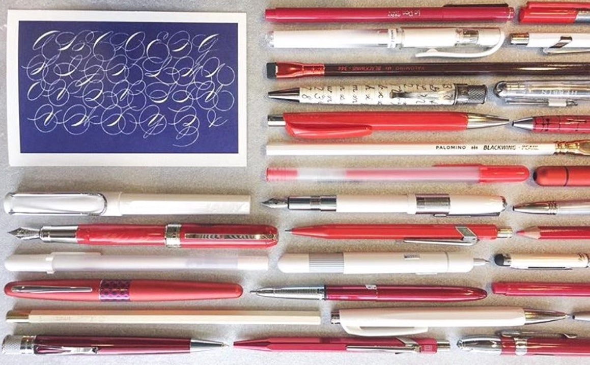 american flag made out of pens and a handwriting postcard