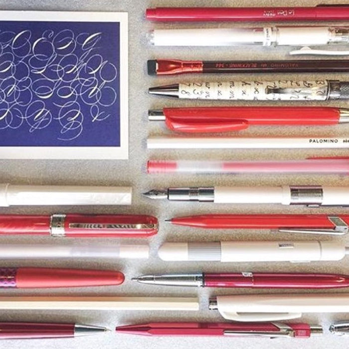 american flag made out of pens and a handwriting postcard