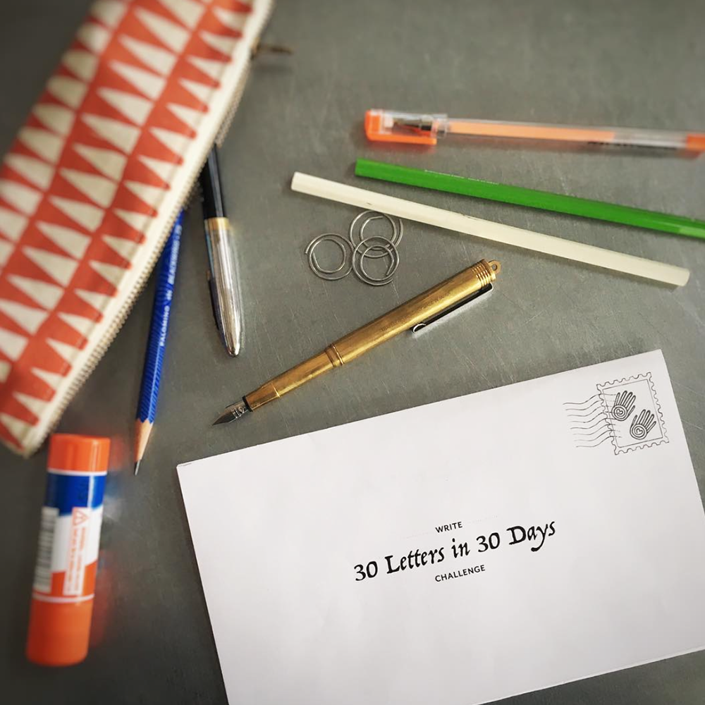 "30 letters in 30 days" log sheet with letter writing supplies