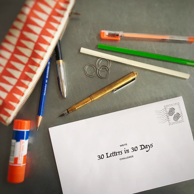 "30 letters in 30 days" log sheet with letter writing supplies