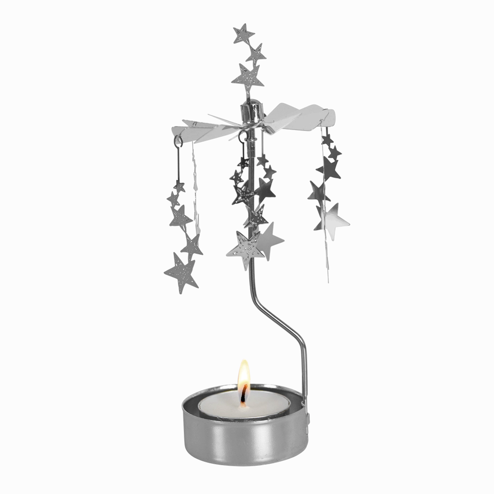 Silver rotary candle holder with lit tea light with silver stars on top and dangling stars hanging from rotary spinner on white background