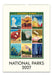 A spiral-bound 2027 National Parks wall calendar featuring a collage of 9 vintage-style national park posters on an off-white page, with the title 'NATIONAL PARKS 2027' printed at the bottom.