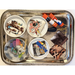 Metal tray with four decorative plates featuring various paper scraps and two glue sticks