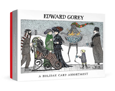 A boxed card assortment titled 'EDWARD GOREY' with an illustrated winter scene on the front. The package shows several people in winter clothing around a fire, with a red spine band visible on the left side.