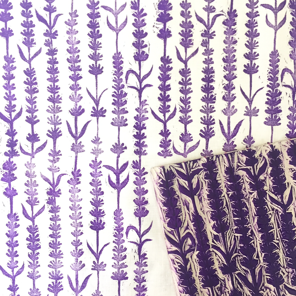 Lavender and cream fabric featuring a repeating vertical lavender plant pattern, with the same pattern on the printing block displayed on top.