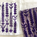 A close-up of a white fabric featuring a purple lavender floral block print. A matching purple and off-white patterned printing block with the same pattern  is placed on top of the printed textile.