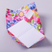 Colorful floral-patterned writing paper with a white square inside for writing on a light gray background