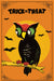 A vintage-style Halloween postcard featuring a black owl with green eyes perched on a branch against a yellow-orange sun and orange background, with the words “TRICK OR TREAT” at the top and bats flying around.