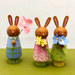 Wee Bunnies Three!  class samples- three peg doll bunnies holding flowers on white background.