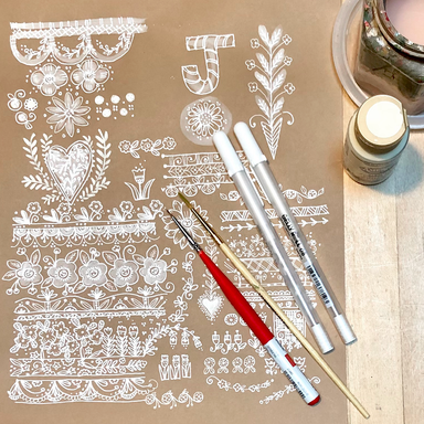 Pattern Magic class doodles with white on kraft paper with art materials