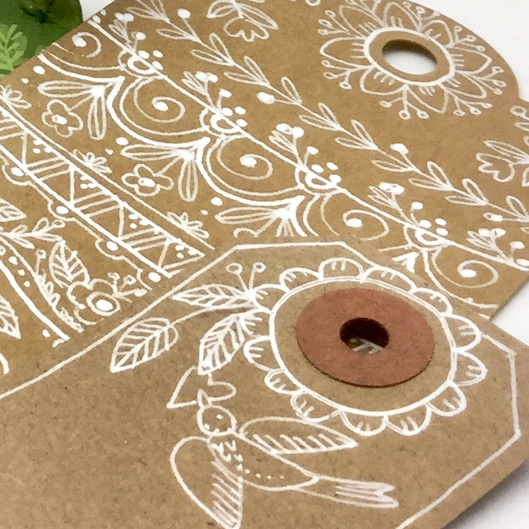 Pattern Magic class doodles- using the with flowers white on kraft paper. tags