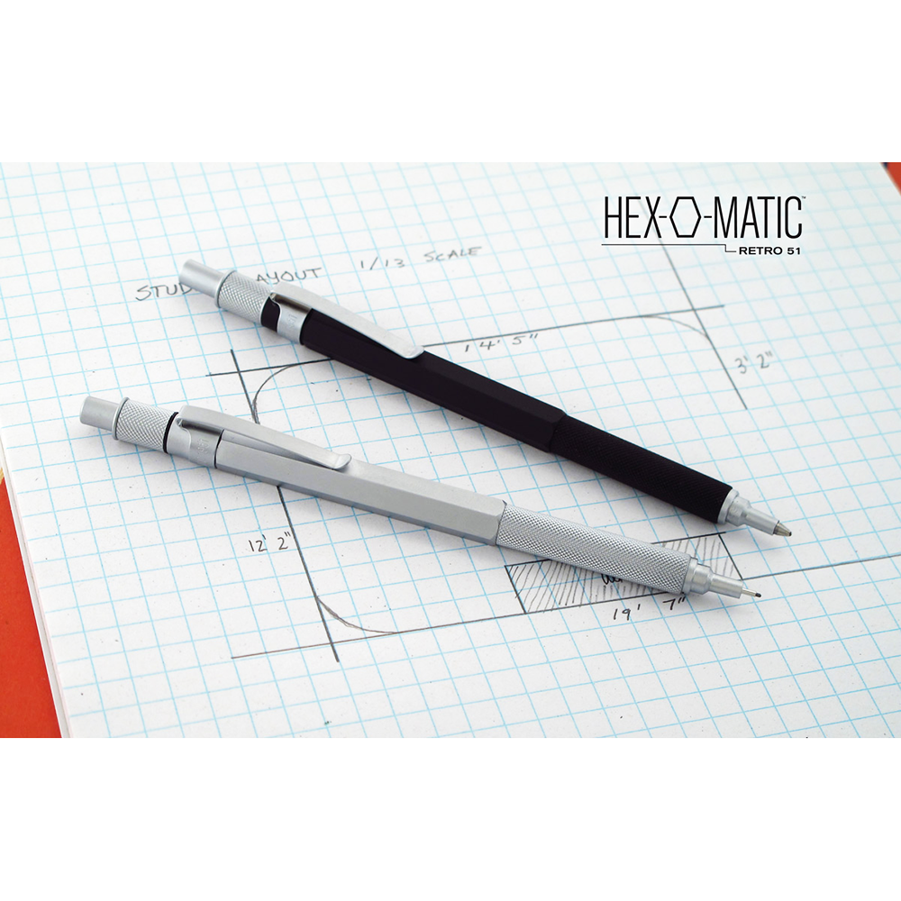 Retro 1951 Hex-o-matic silver pencil and black pen on graph paper background