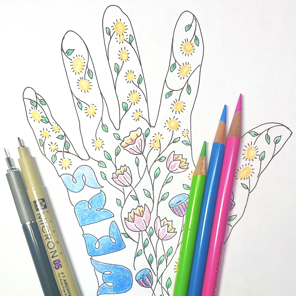 Art-Filled Hand  class sample with colorful flowers and art supplies