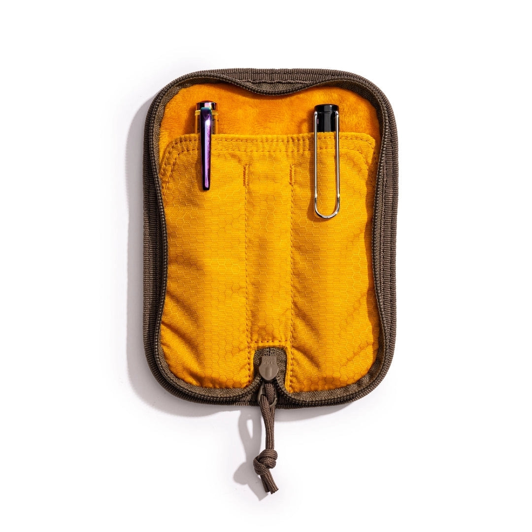 Lochby Duo Pen Pouch brown in color shown lying open with yellow interior and two sample pens (not included) show in pouches