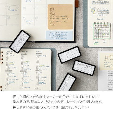 Midori Stamp Pad- Half Size Time Tracker shown with other styles and notebooks