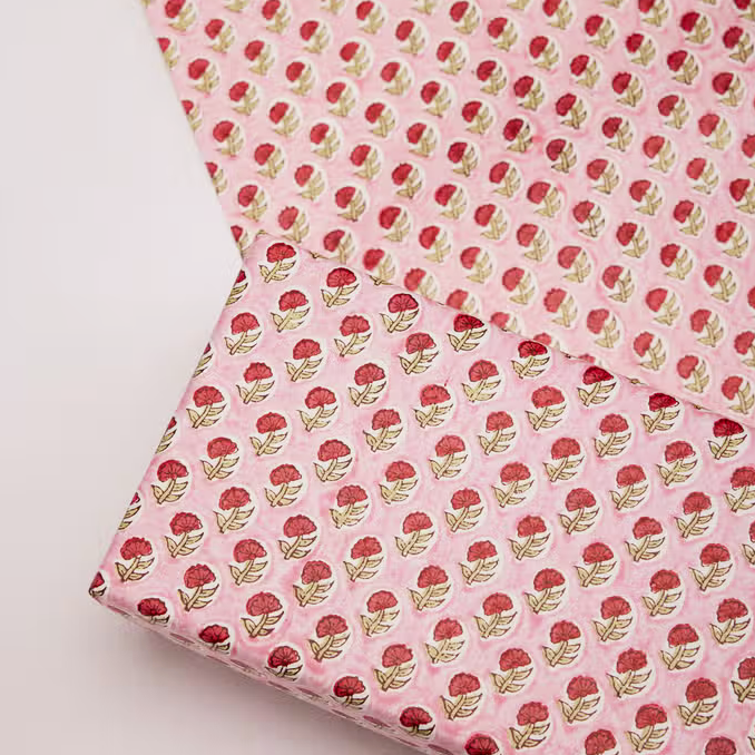 Handmade Indian Cotton Paper- Block Printed Red Daisy with pink background wrapped around a box and with flat sheet