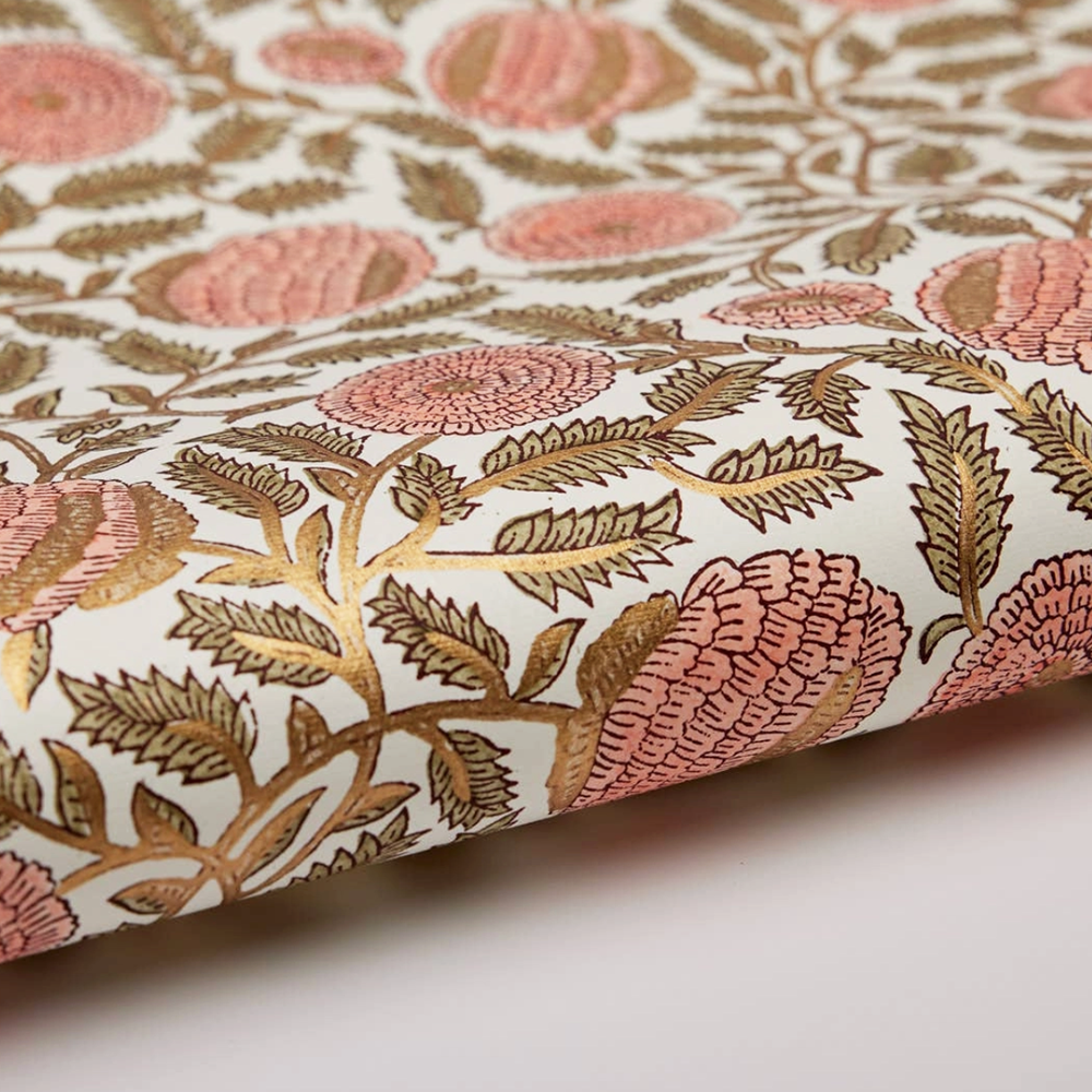 Sheet of floral paper with pink and gold flowers on a white background