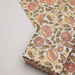 Floral patterned paper with one flat sheet along with a wrapped box in the same paper