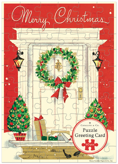 Merry Christmas puzzle greeting card with a wreath, trees, and presents on a red background.