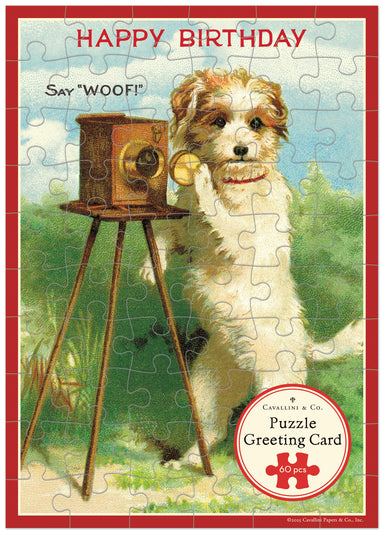 Vintage-style puzzle greeting card with a dog and camera, featuring the text 'Happy Birthday Say Woof!'.