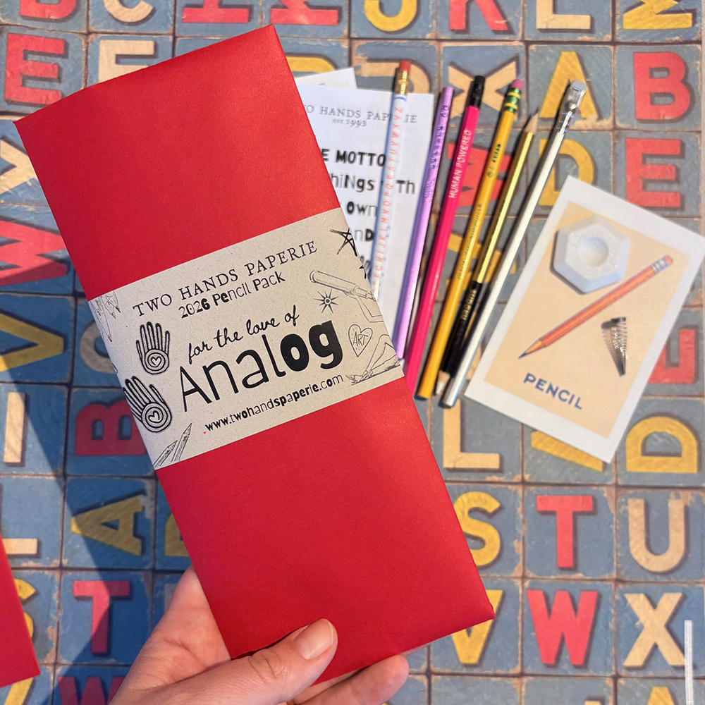 THP 2026 Limited Edition Pencil Pack- red packaging and pencils shown in background on alphabet paper