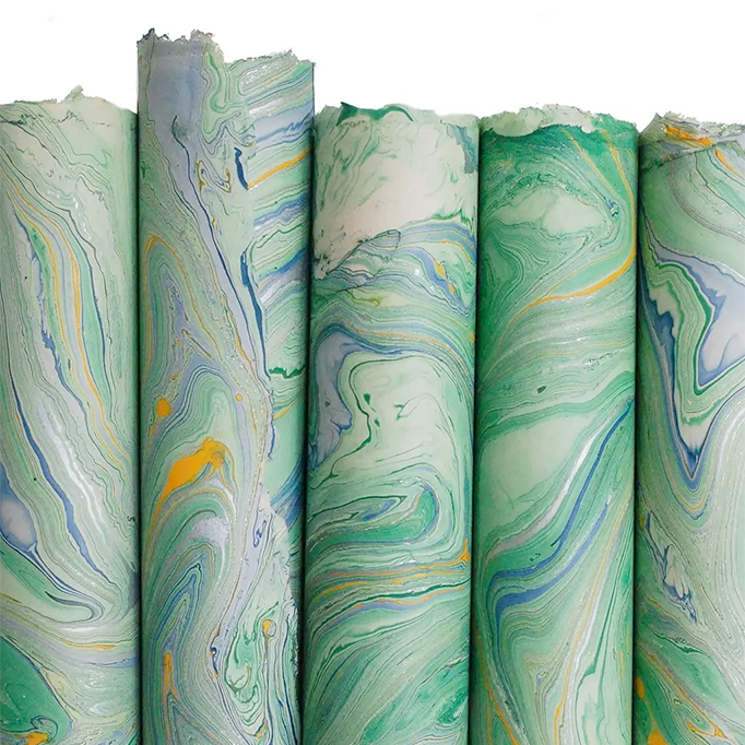 Handmade Marbled Paper- Green and Blue with Silver and Yellow 5 sheets rolled to show pattern variations