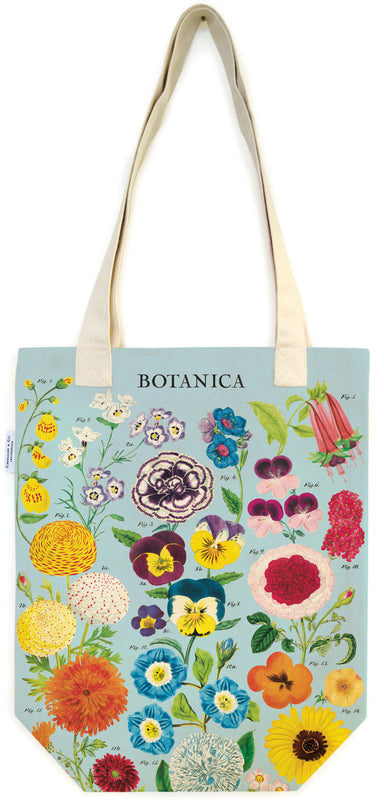 Tote bag with floral design and 'BOTANICA' branding on a light blue background