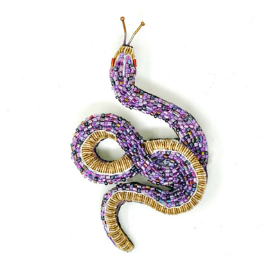 Beaded snake with purple and gold beads on a white background