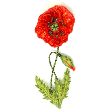 Red embroidered and beaded poppy flower with green leaves and bud on a white background