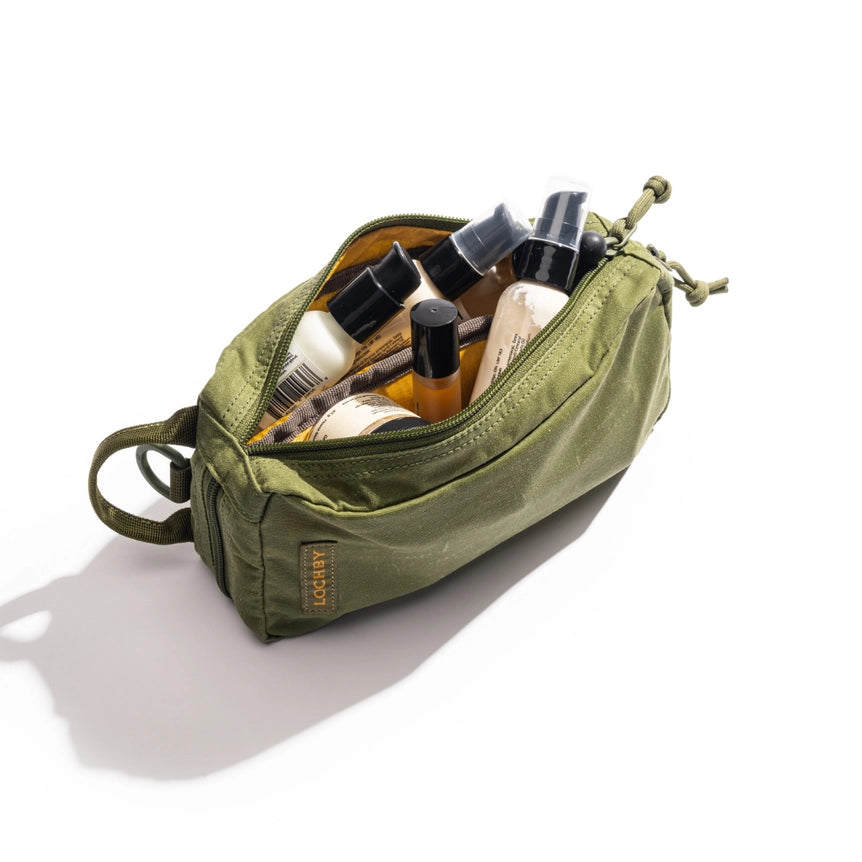 Lochby Venture Pouch- olive with yellow interior shown full of toiletries