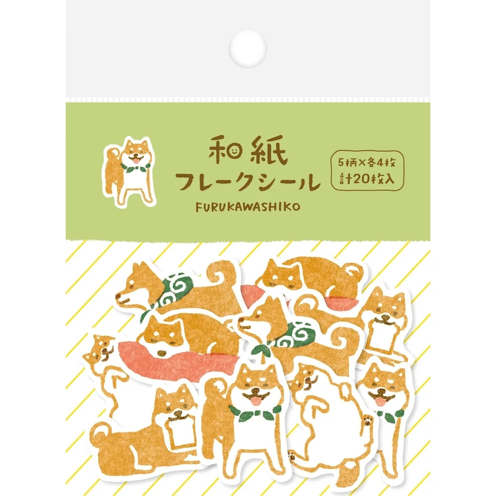 A package of Japanese paper stickers featuring cute Shiba Inu dog illustrations in orange, white, and green, with a light green header card and Japanese text.