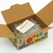Open cardboard box labeled 'Veggies Market' with packing material and an invoice inside.