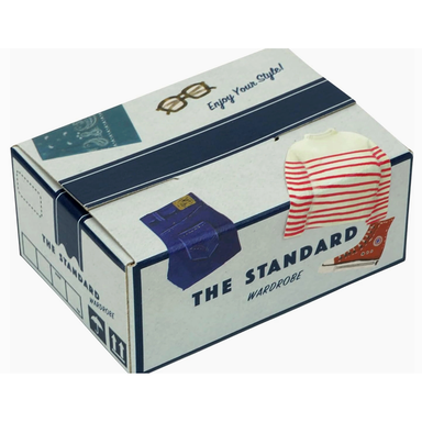 Box from 'The Standard Wardrobe' with clothing images on a white background