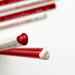 Red and white heart shaped pencils with 'LOVE' text on a white background