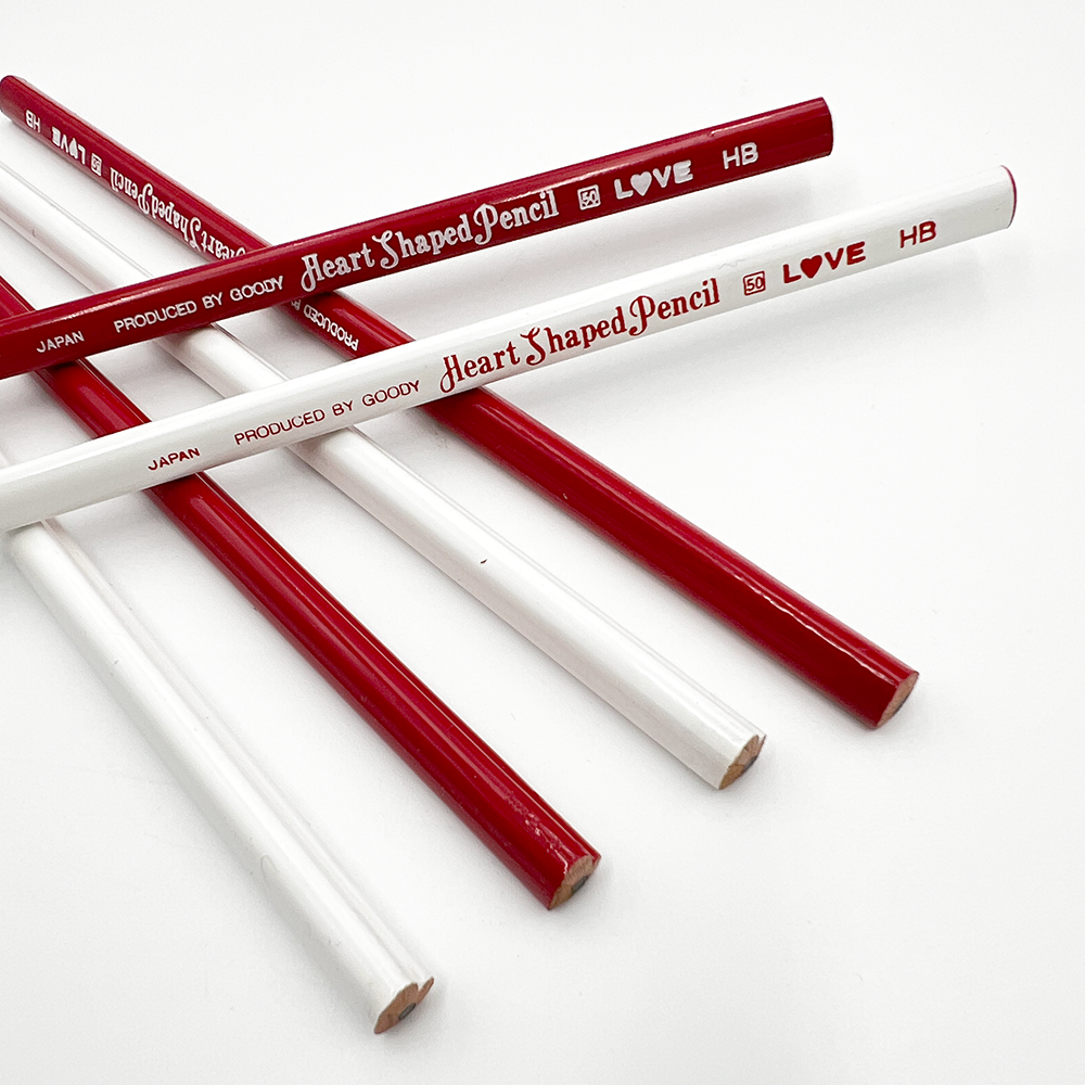 Red and white heart-shaped pencils on a white background