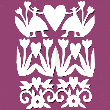 White paper cutout designs featuring stylized figures, tulips, hearts, and decorative scrollwork, arranged on a solid purple background.