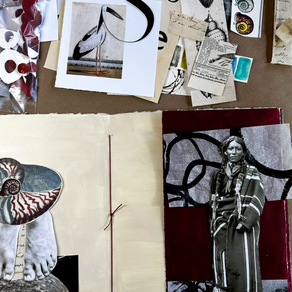 An open mixed-media collage book  layout spread on a brown surface, showing layered papers, photographs, fabric, ink marks, and collage elements including a stork print, a nautilus shell, a black-and-white portrait, and deep red and cream sections.