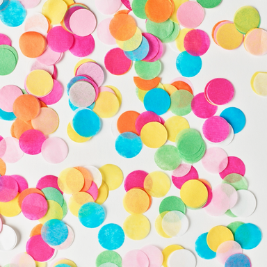 Colorful confetti dots on a white background