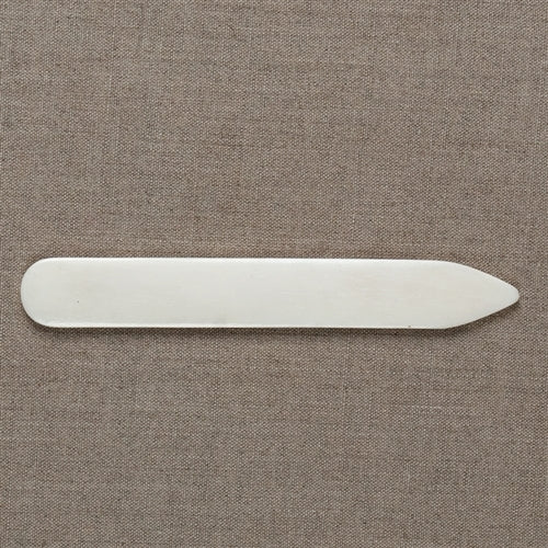 white bone folder shown flat