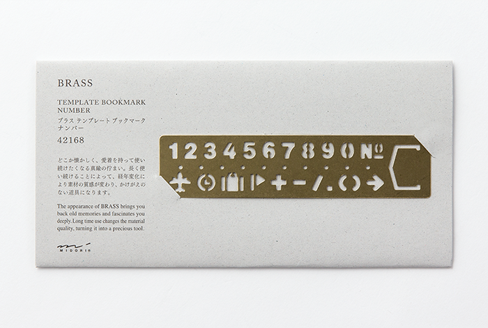 The TRAVELER'S COMPANY Numbers Brass Bookmark allows you to mark the page of your favorite journal while using the numbers as a stencil to make  neat labels and page headings.