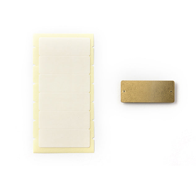 Use the adhesive backs for the Midori Brass Label Plates. 
