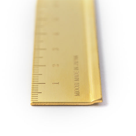 Use the Midori Brass Ruler to mark a straight edge in your notebook or Midori Traveler's Notebook. 