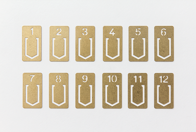 TRAVELER'S COMPANY Brass Number Clips comes with 12 clips. 