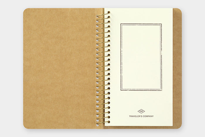 Traveler's Company Spiral Ring Paper Pocket Notebook lies flat when open.