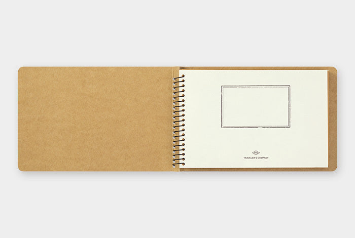 The Traveler's Company Spiral Ring Notebook is the perfect place to store your mementos. The spiral notebook is reminiscent to the classic manilla notebook but with a twist- a window to see what is stored inside. 